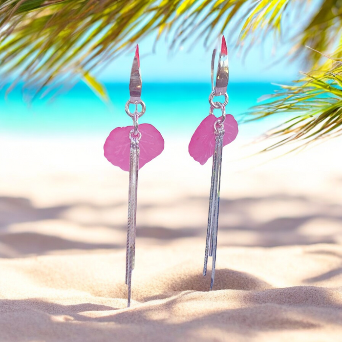 Discover the enchanting allure of these pink sweet pea sterling silver earrings, accented with liquid silver. Their unique design and soft color make them a delightful addition to your jewelry collection, perfect for everyday wear.