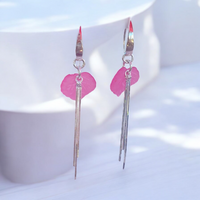 Discover the enchanting allure of these pink sweet pea sterling silver earrings, accented with liquid silver. Their unique design and soft color make them a delightful addition to your jewelry collection, perfect for everyday wear.